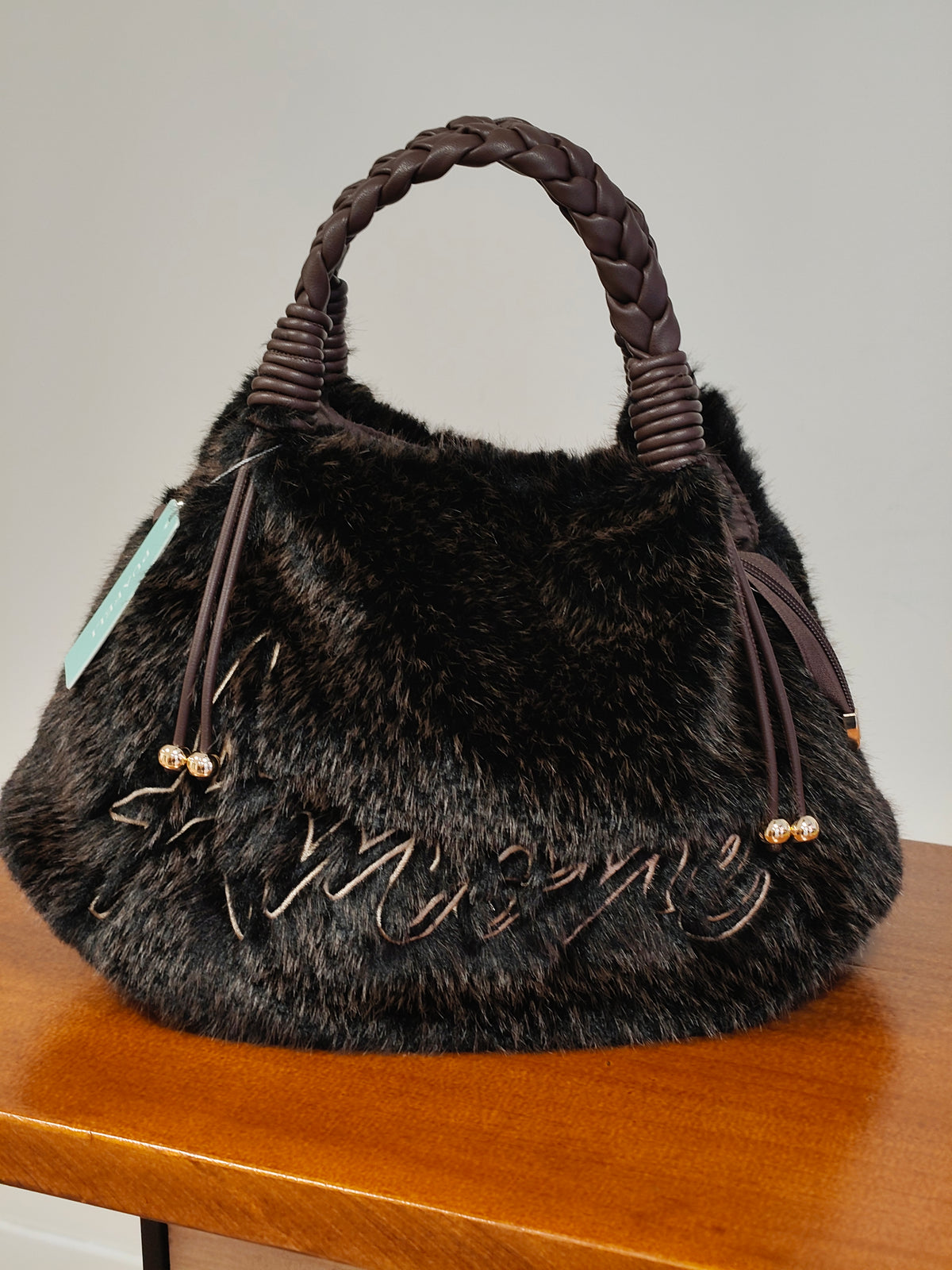 Bolso de mano y bandolera de pelo sintético